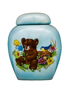 Teddy bear on blue urn | Silver Prairie Urns