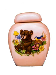 Teddy bear on pink urn | Silver Prairie Urns