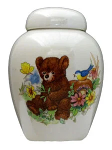 Teddy bear on white urn | Silver Prairie Urns